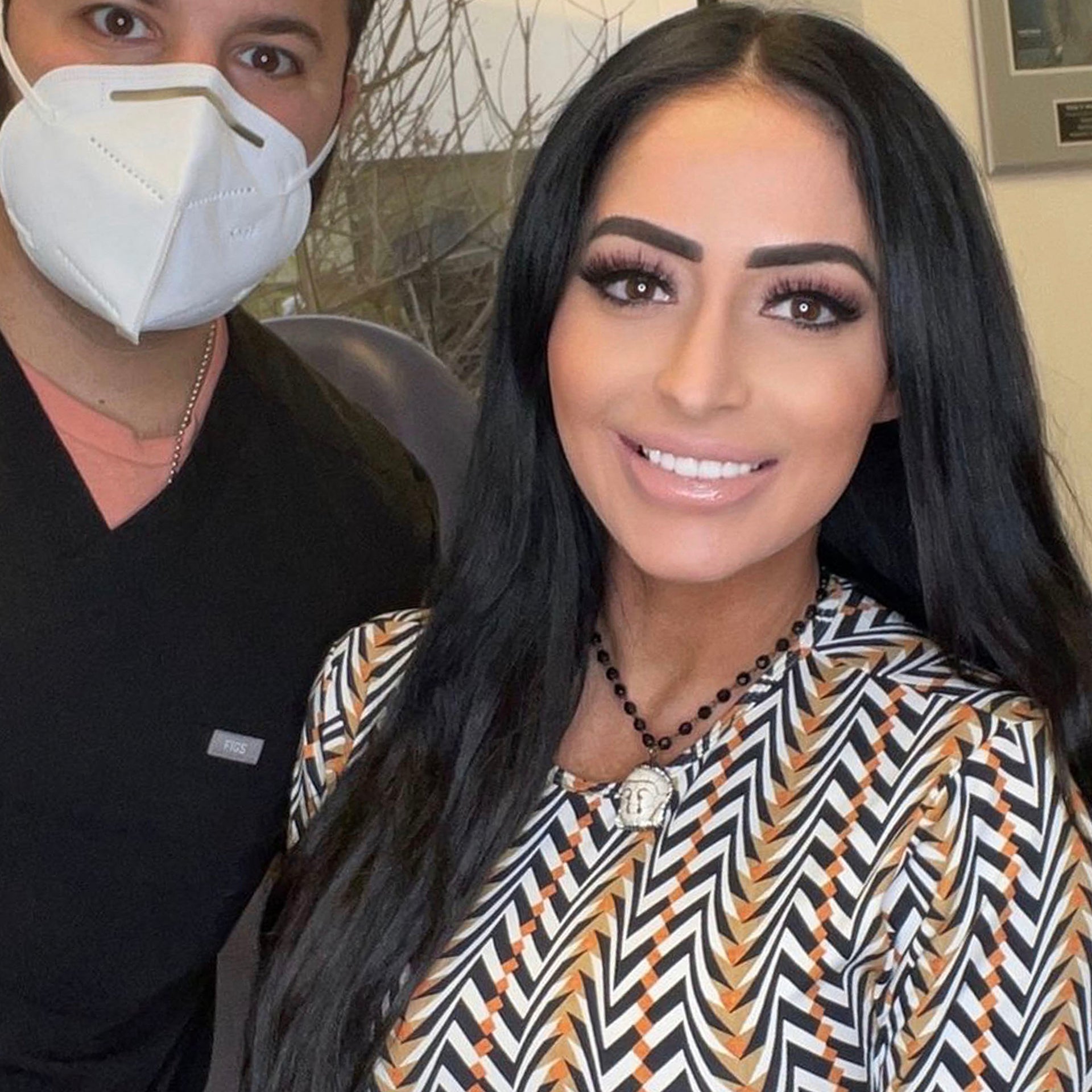  angelina wearing black buddha necklace