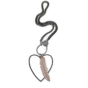 Minimalist open heart charm paired with a delicate feather charm
