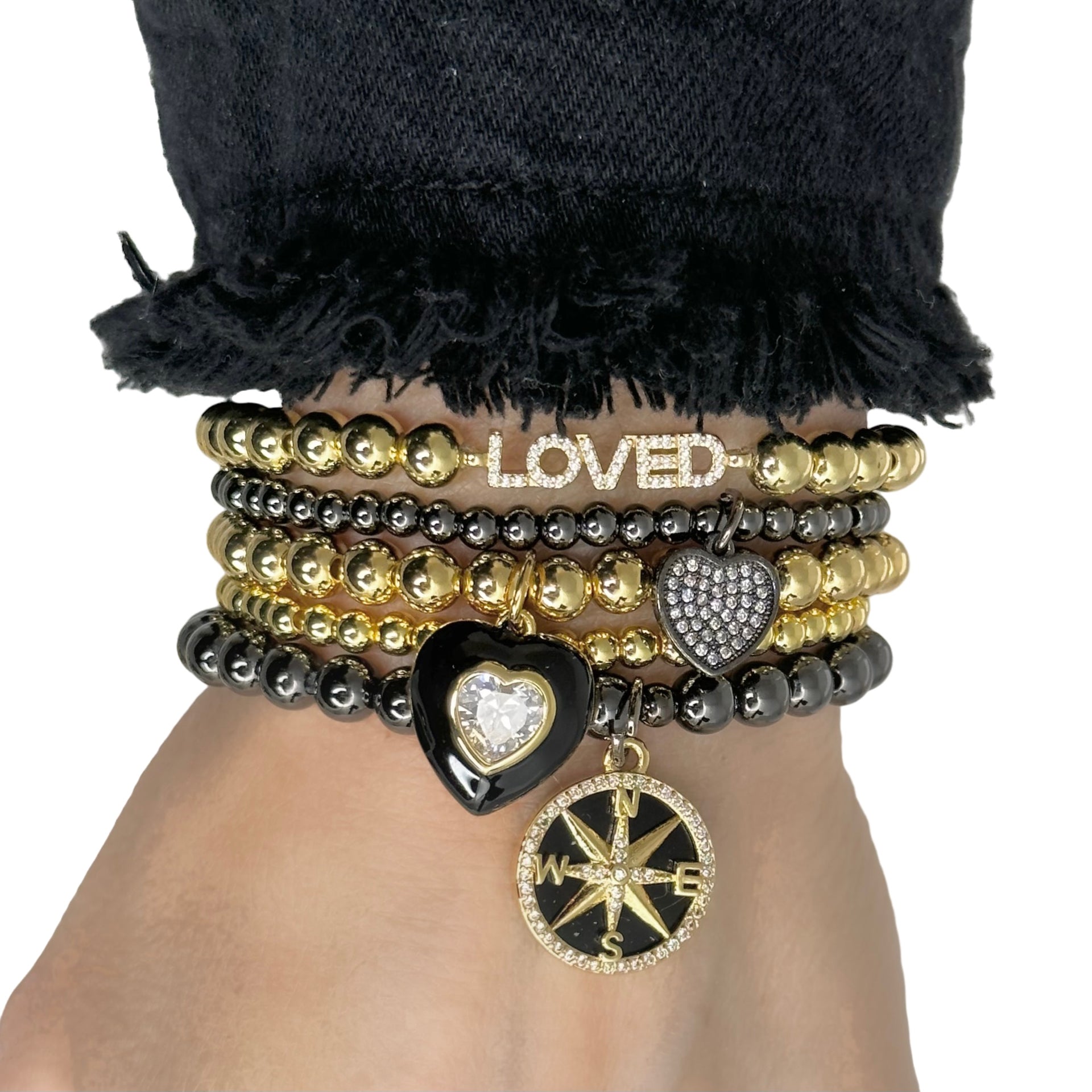 love lisa cindi compass bracelet lifestyle photo gold and black compass charm stack