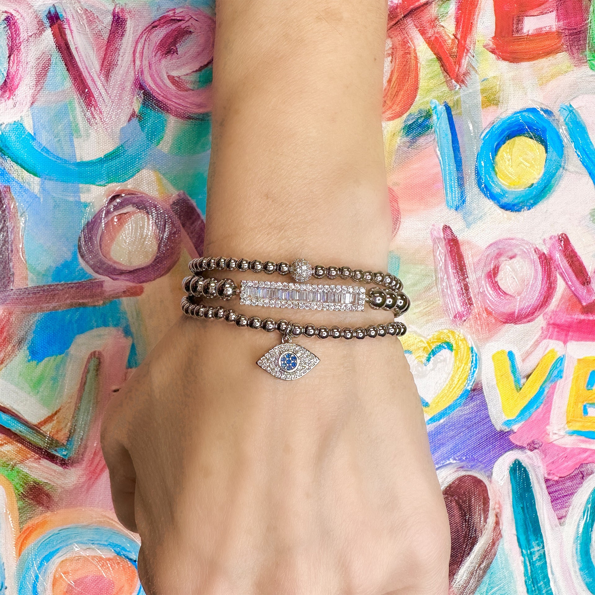 love lisa cynthia small eye bracelet lifestyle wrist stack with colorful outfit