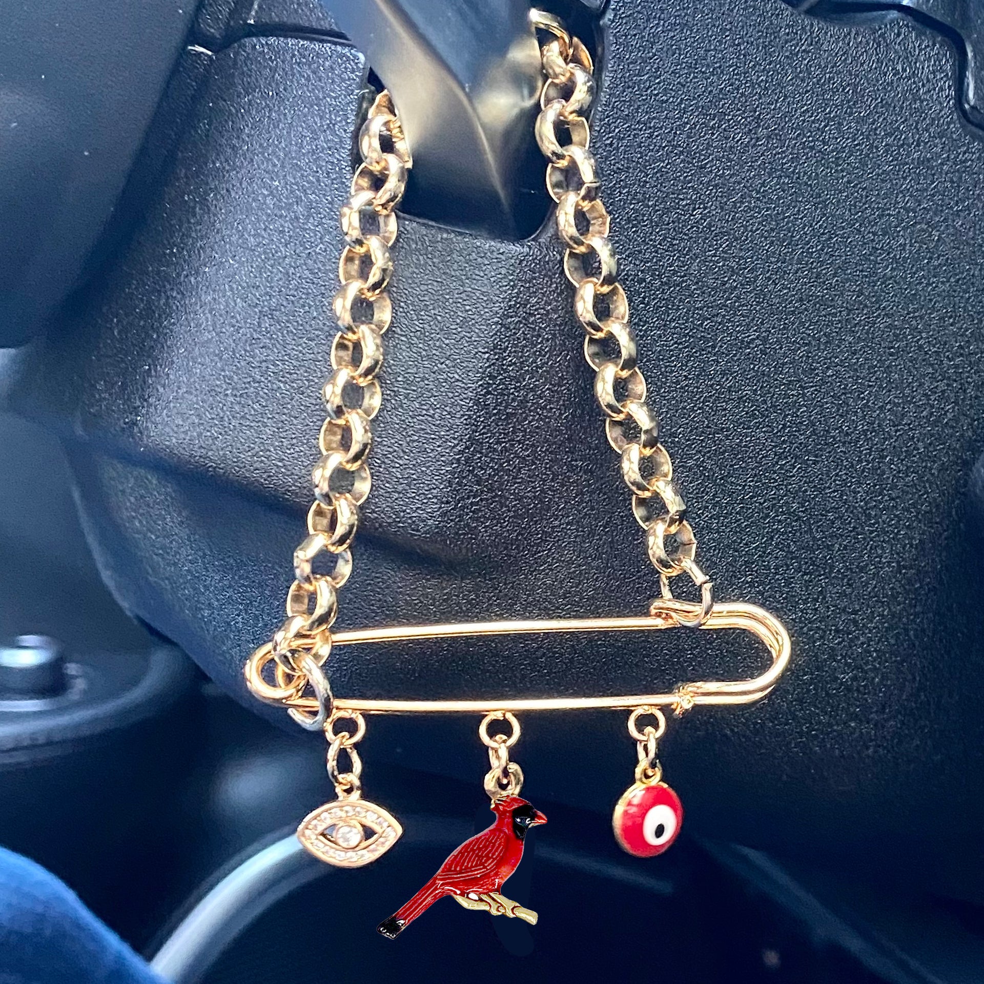 drive safe cardinal car pin hanging from car handle with red bird charm
