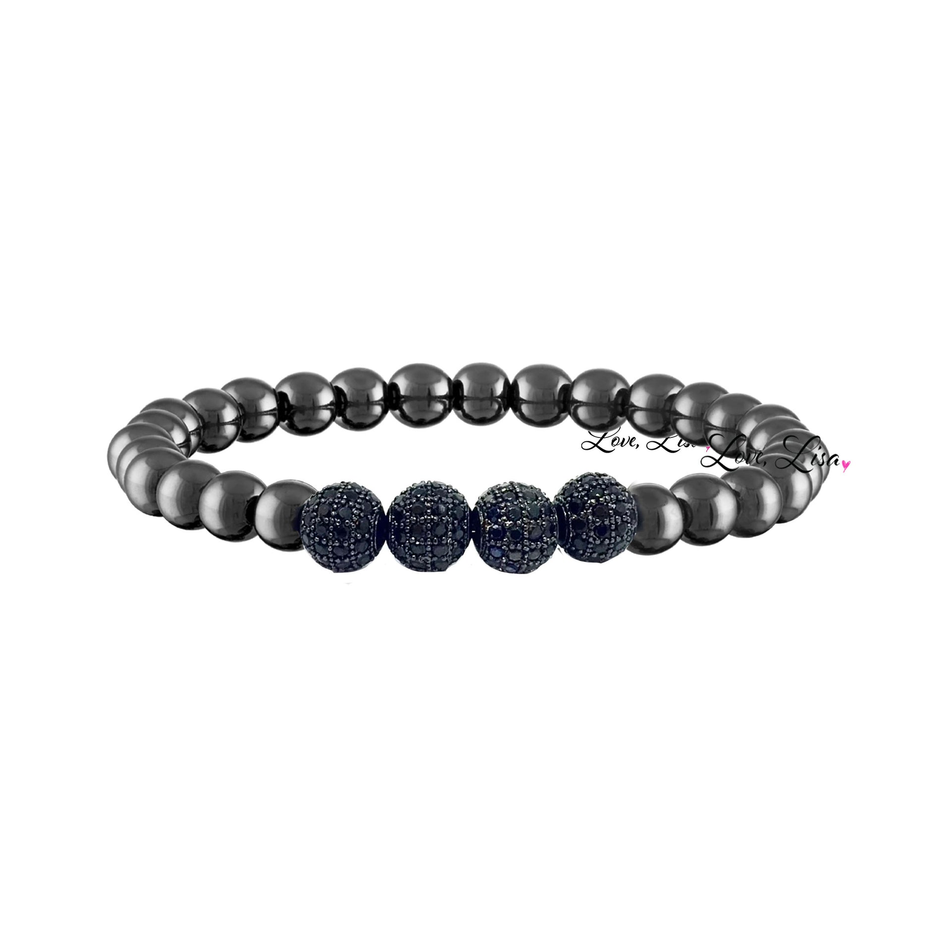 A men's bracelet featuring a series of black diamond pave beads with gunmetal accents, ending with a black diamond center bead.