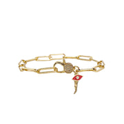 Gold Italian horn bracelet with red enamel evil eye charm on paperclip chain displayed 