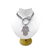 glam hamsa charm love lisa jewelry displayed on clasp necklace with crystals and heart cutout design