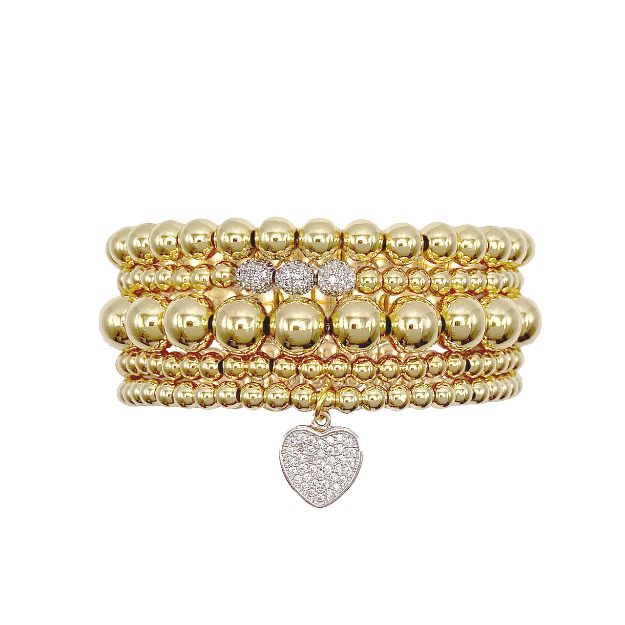 Goldie bracelet stack in gold with pavé heart charm and five beaded stretch bracelets