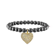 lila allure beaded heart bracelet with gunmetal metallic beads paired with gold tone beads and a gold framed pave heart charm