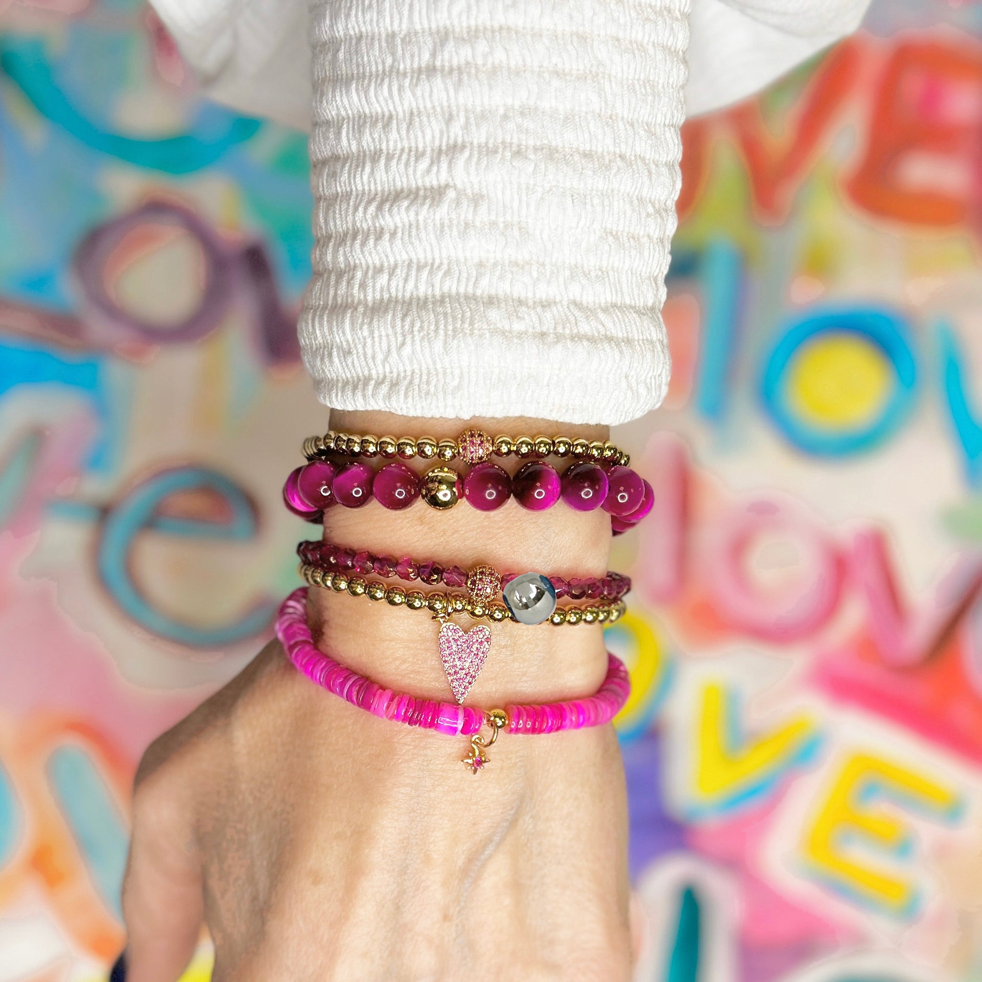 love lisa wrist stack wearing madison colorful candy pave bracelets in pink tones