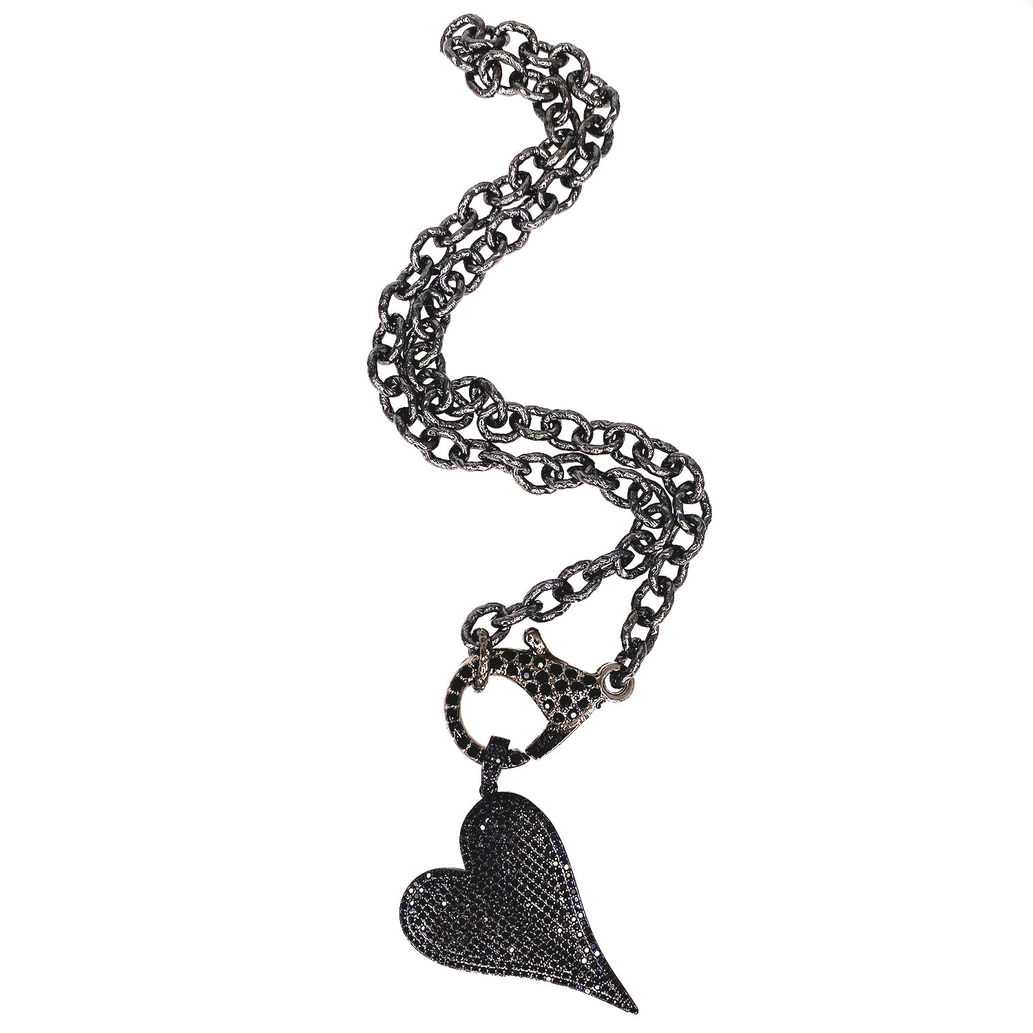 Pavé black heart charm with slanted silhouette on necklace