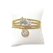 Myra's Religious Saint Stack featuring Saint Benedict, Padre Pio, and Miraculous Medals for spiritual protection and healing