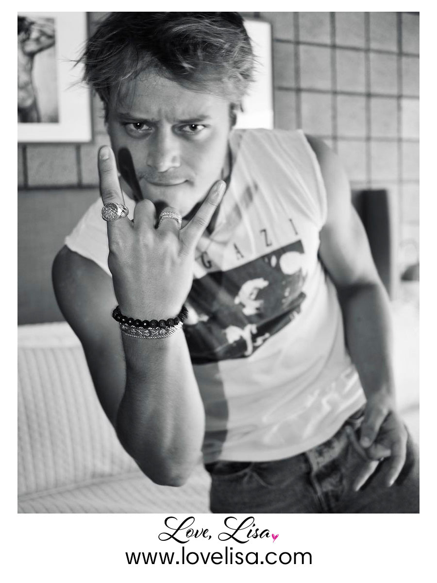 Love Lisa rudy lava rock mens beaded bracelet black lava stretch bracelet on wrist worn by Rudy Pankow, AKA JJ Maybank on the Netflix drama Outer Banks