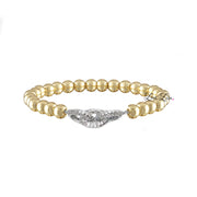 Love Lisa Silvania’s Link Bracelet in gold with pavé infinity charm