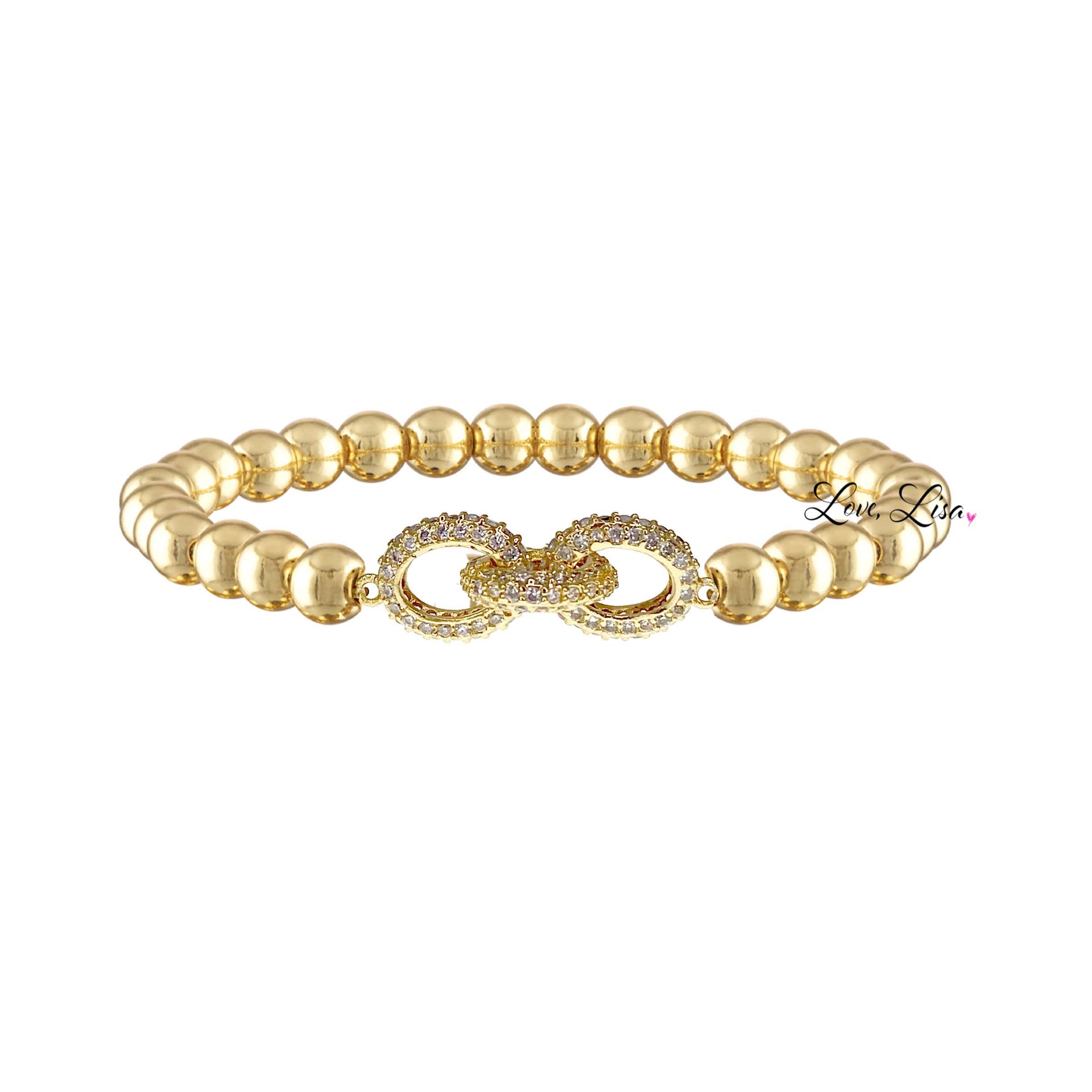 A gold-colored bracelet featuring a series of round beads and a decorative link in the center, on a white background.