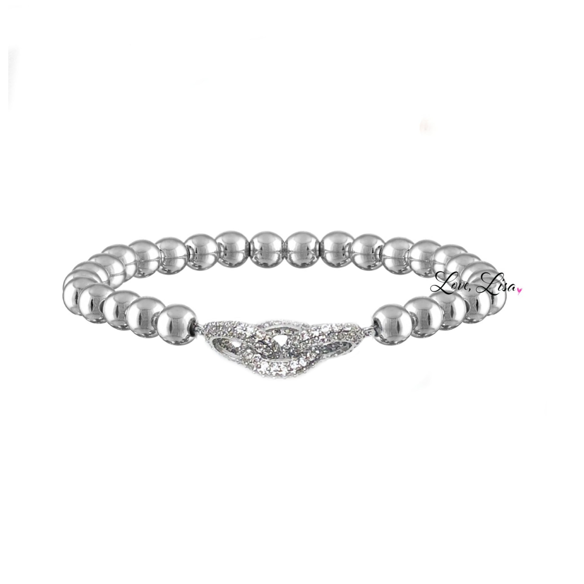Love Lisa Silvania’s Link Bracelet in silver with pavé infinity charm