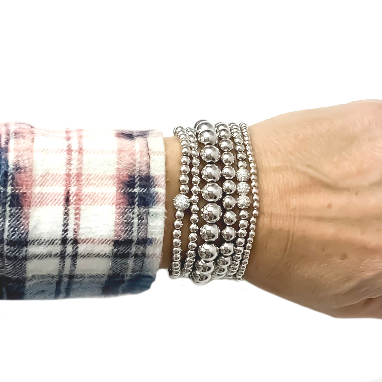 silver six stack of beaded bracelets worn on wrist stacked style love lisa