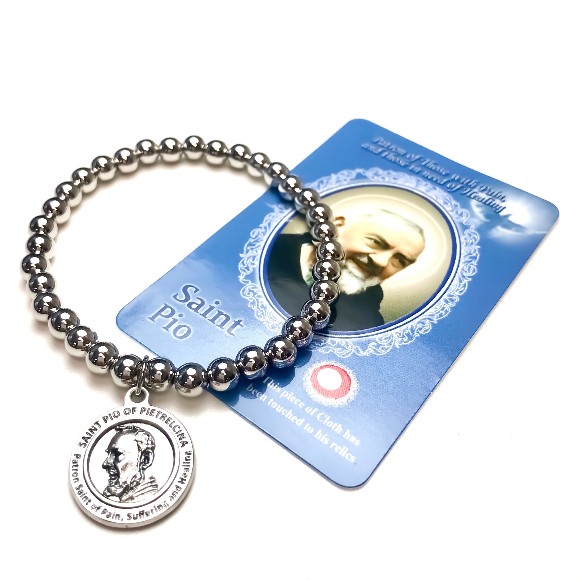 silver stretch saint padre pio healing bracelet shown with prayer card love lisa