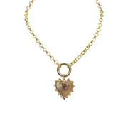 gold striking heart necklace with spiked pendant
