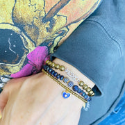 Love Lisa evil eye heart bracelets stacked on wrist gold beaded charm jewelry