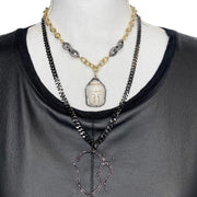 Love Lisa Tania Happy Buddha Necklace layered on display gold spiritual necklace