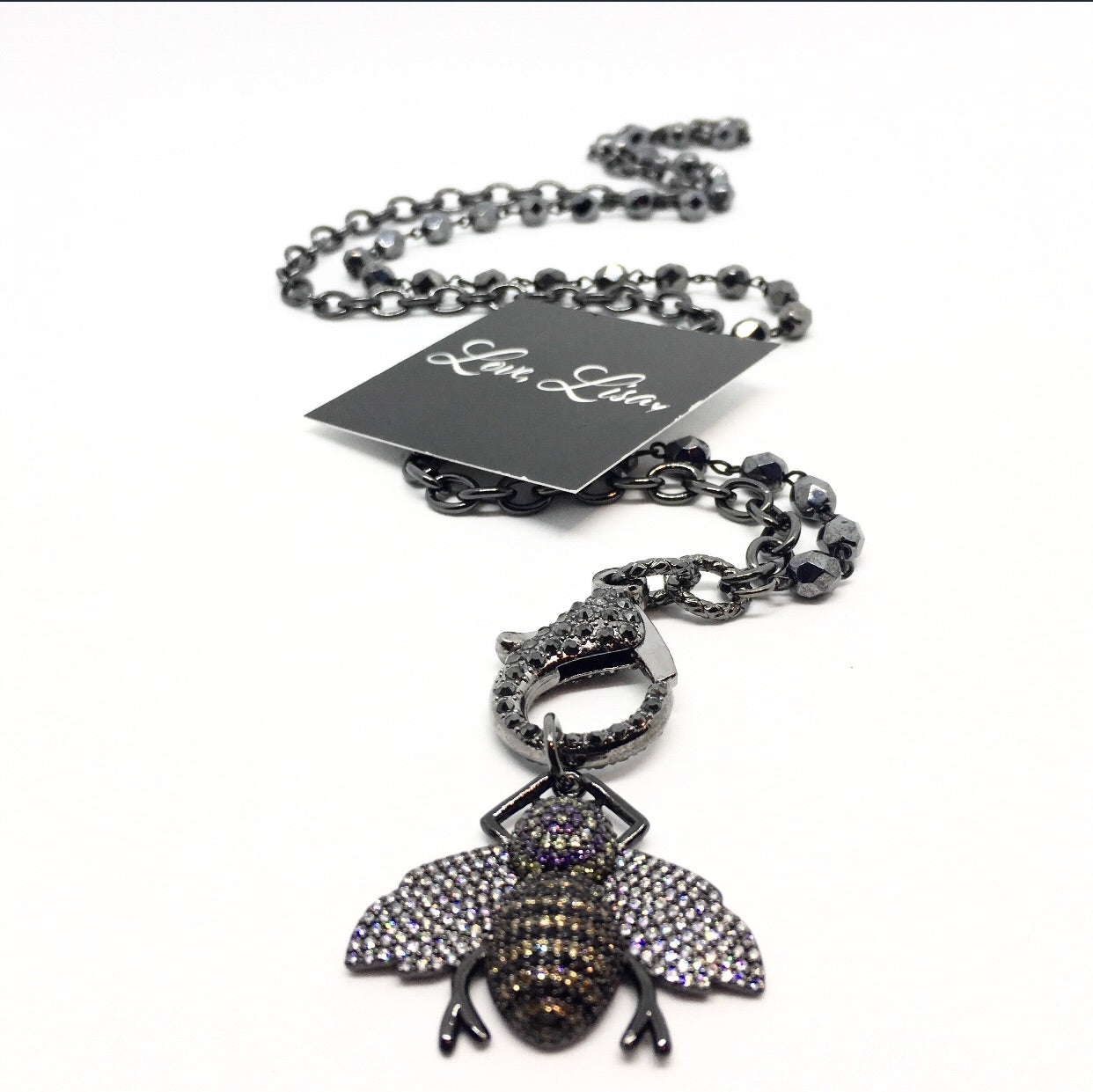 Queen Bee Charm styled on a gunmetal lobster clasp chain with Love, Lisa tag
